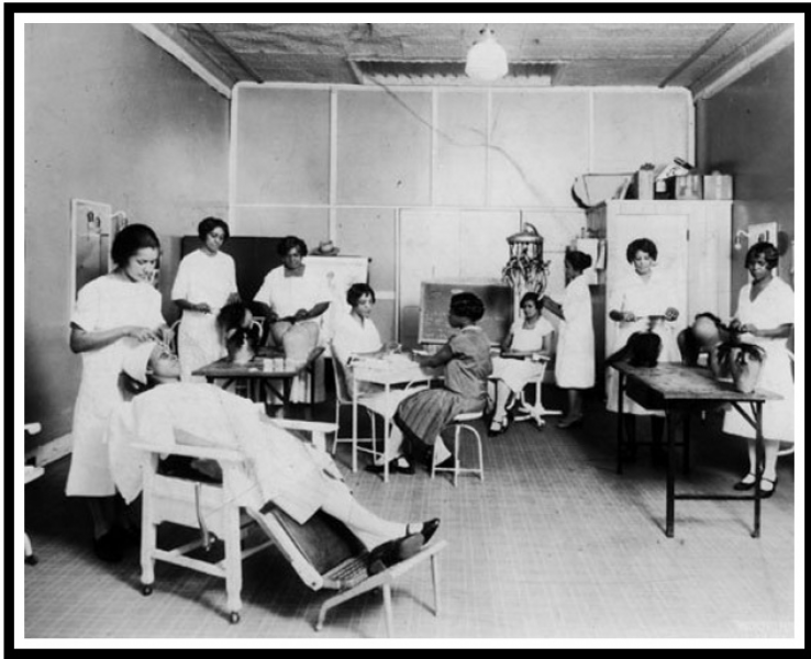 Photo of beautician trainees, with Joyner machine in background. Courtesy of Chicago Public Library. 